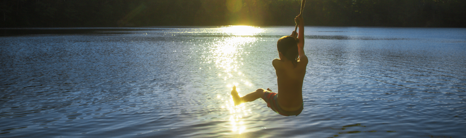 Water safety image of a boy swimming under water